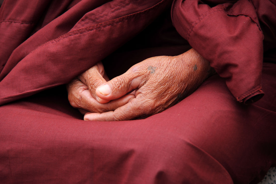 The monk holds his hands together