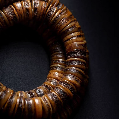 Bone mala with a dark background